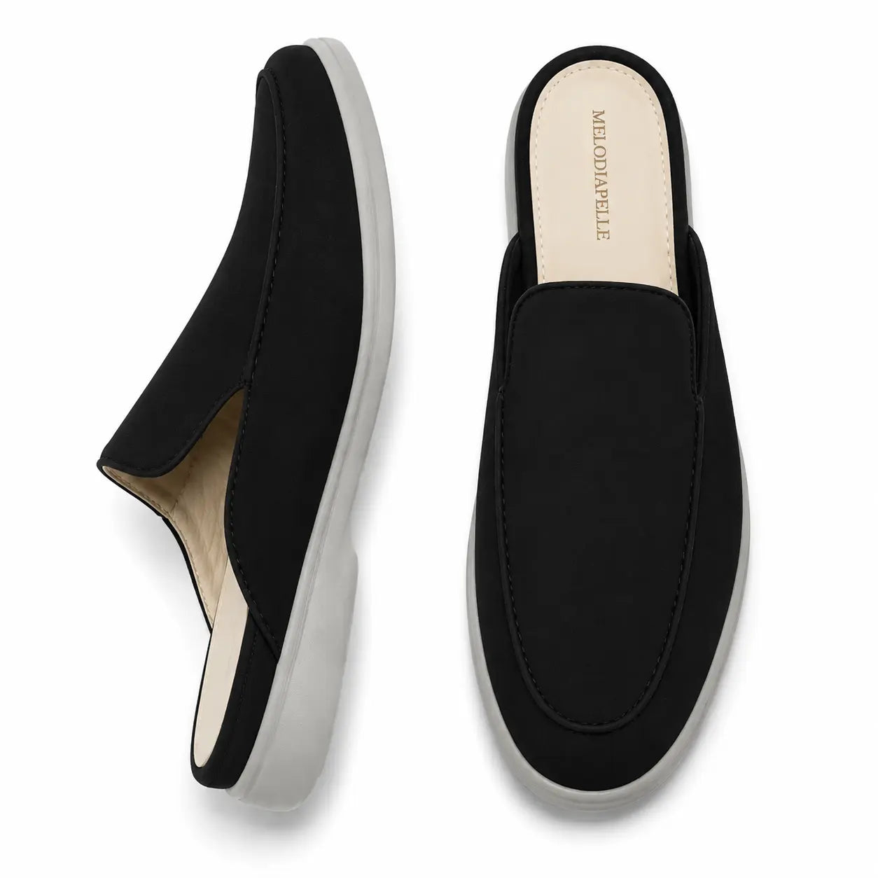 Black suede backless mule slipper, three-quarter angle showing heel and sole detailing