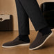 Melodiapelle Mole Mule in dark brown suede worn with trousers, on-feet shot