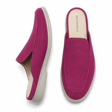 Magenta pink suede backless mule slipper, three-quarter angle showing heel and sole detailing