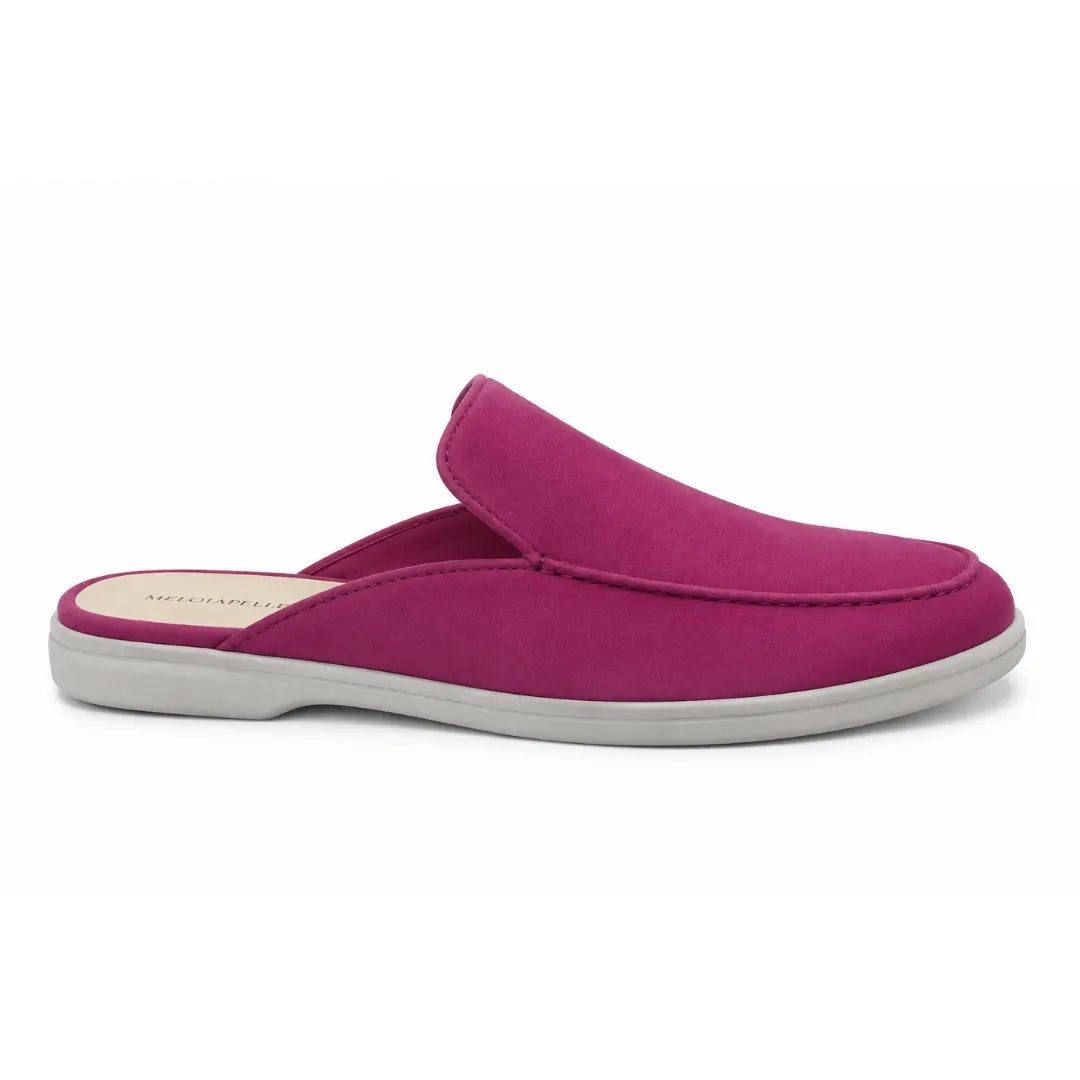 Side profile of the Mole Mule in magenta pink suede on white background