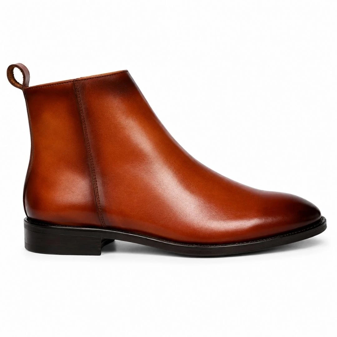 Side profile of the Molino Zip Ankle Boot in burnished cognac leather on white background