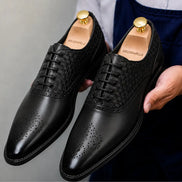 Black leather woven brogue Oxford, three-quarter angle showing heel and brogue detailing