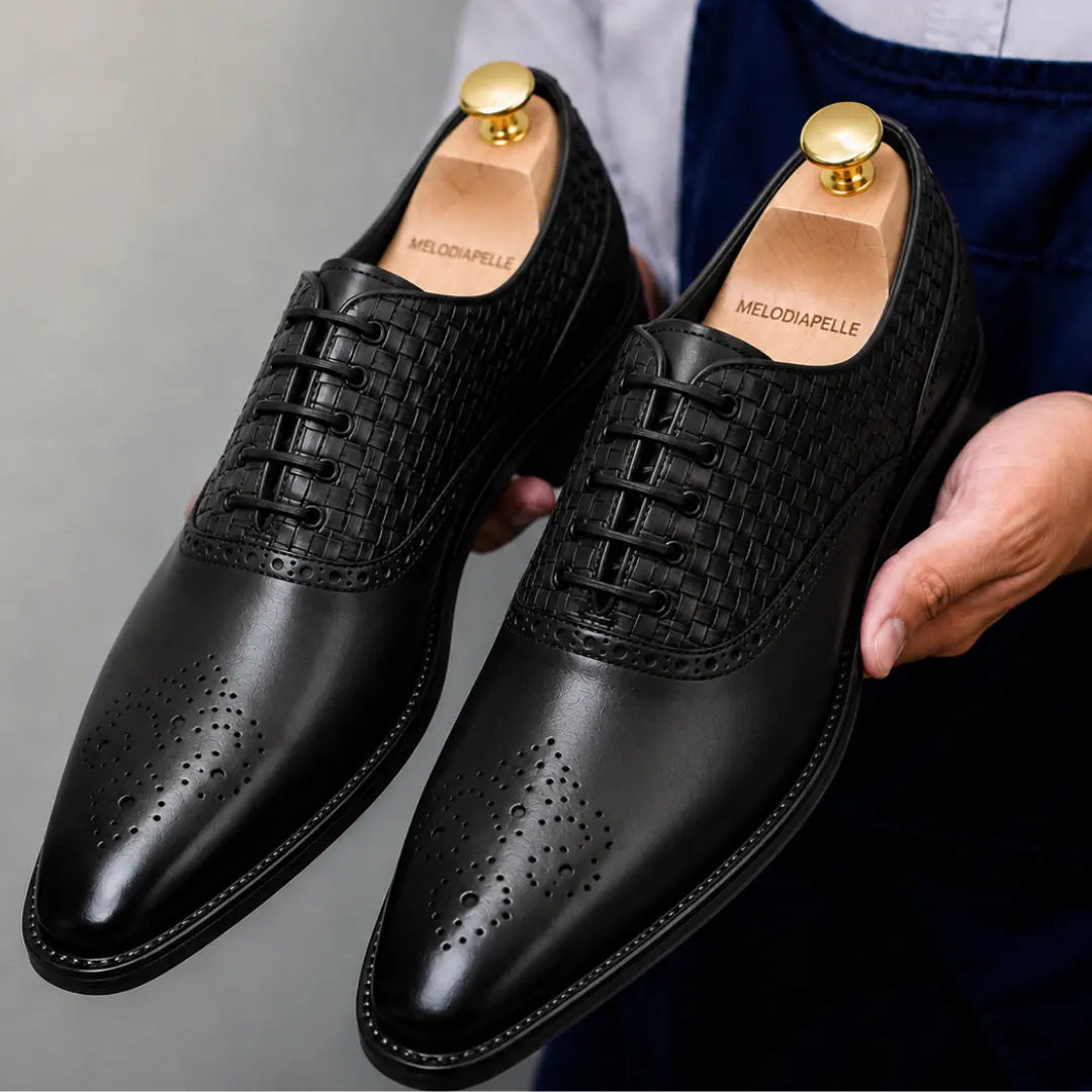 Black leather woven brogue Oxford, three-quarter angle showing heel and brogue detailing
