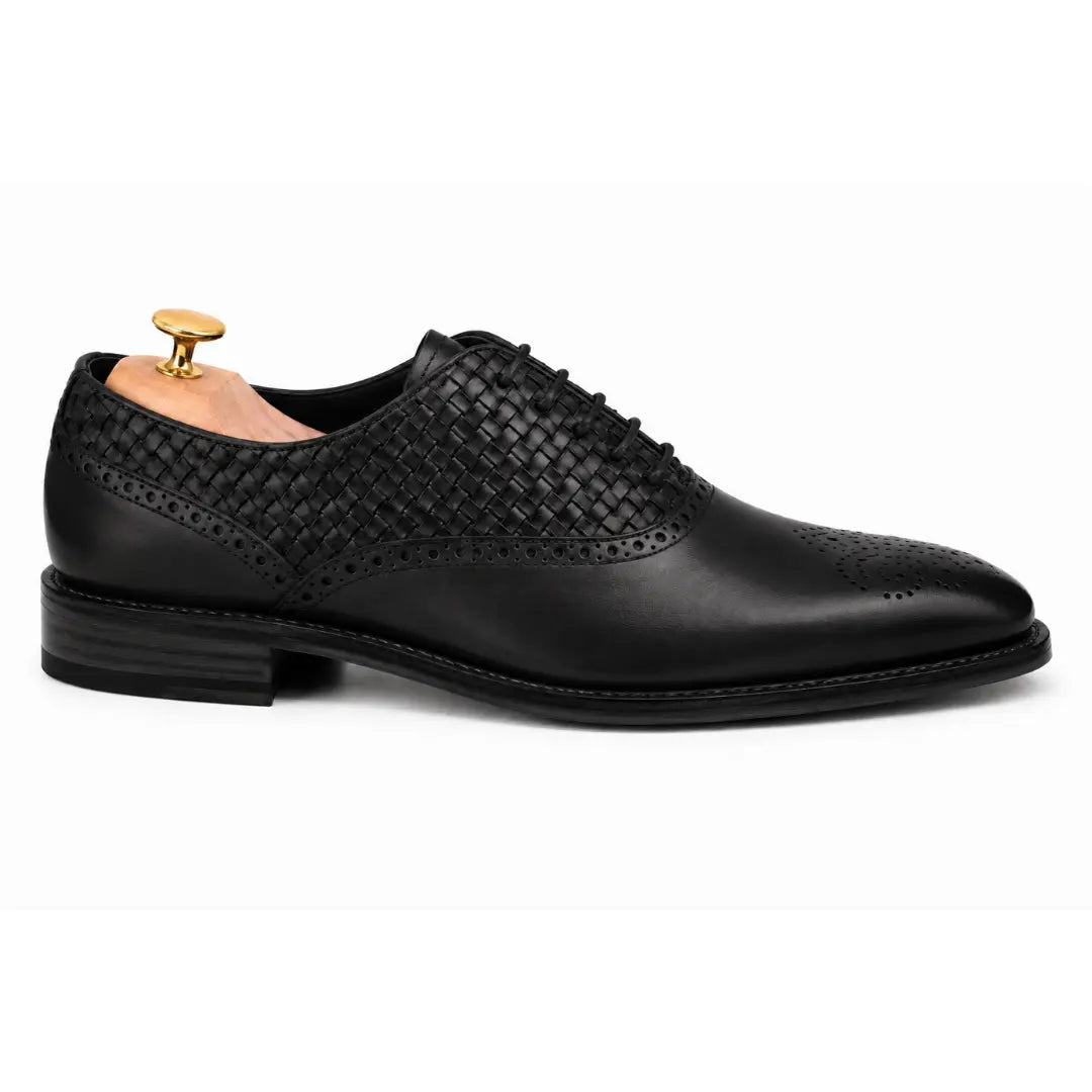 Side profile of the Monaldo Woven Brogue Oxford in black leather on white background