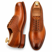 Honey cognac leather woven brogue Oxford, three-quarter angle showing heel and brogue detailing