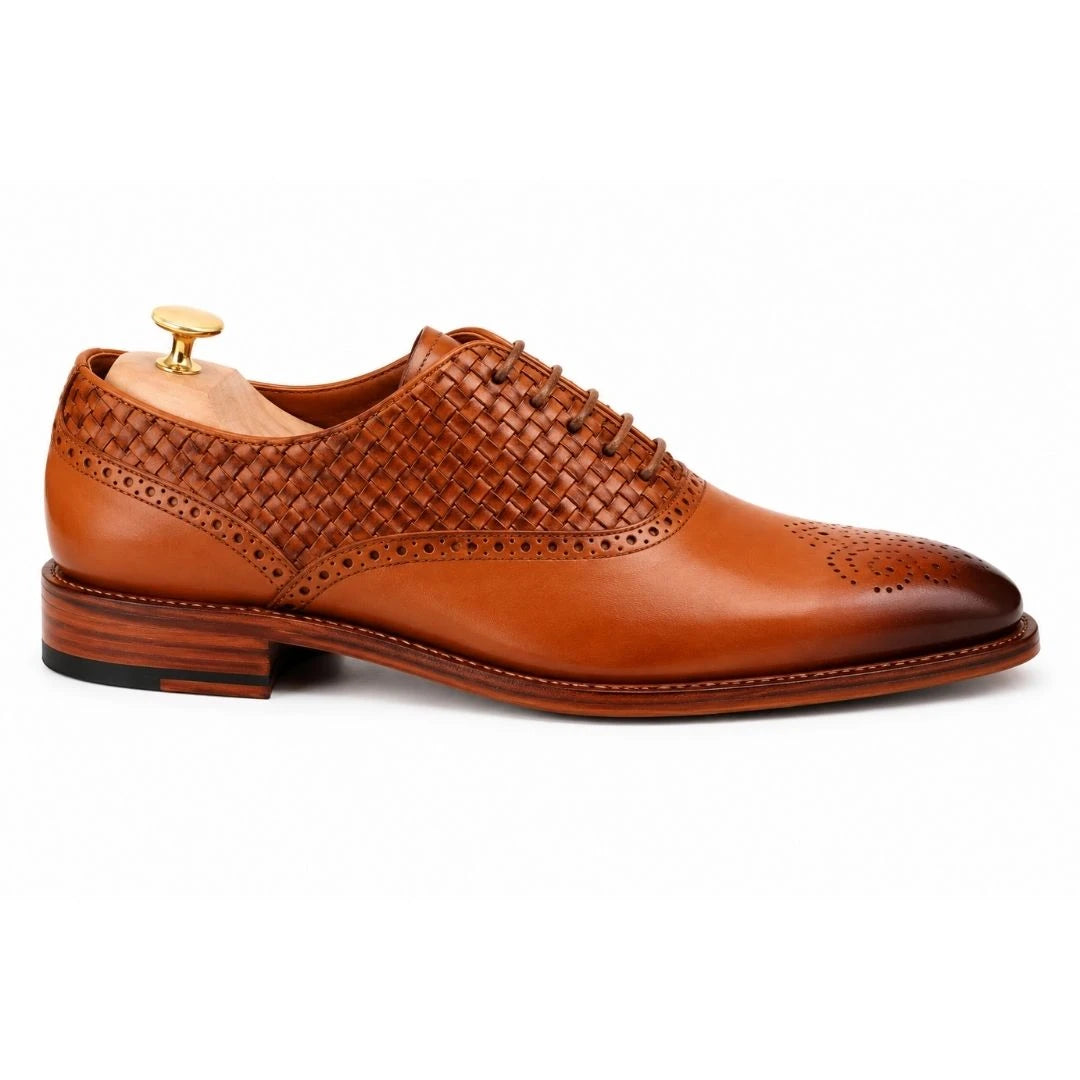 Side profile of the Monaldo Woven Brogue Oxford in honey cognac leather on white background