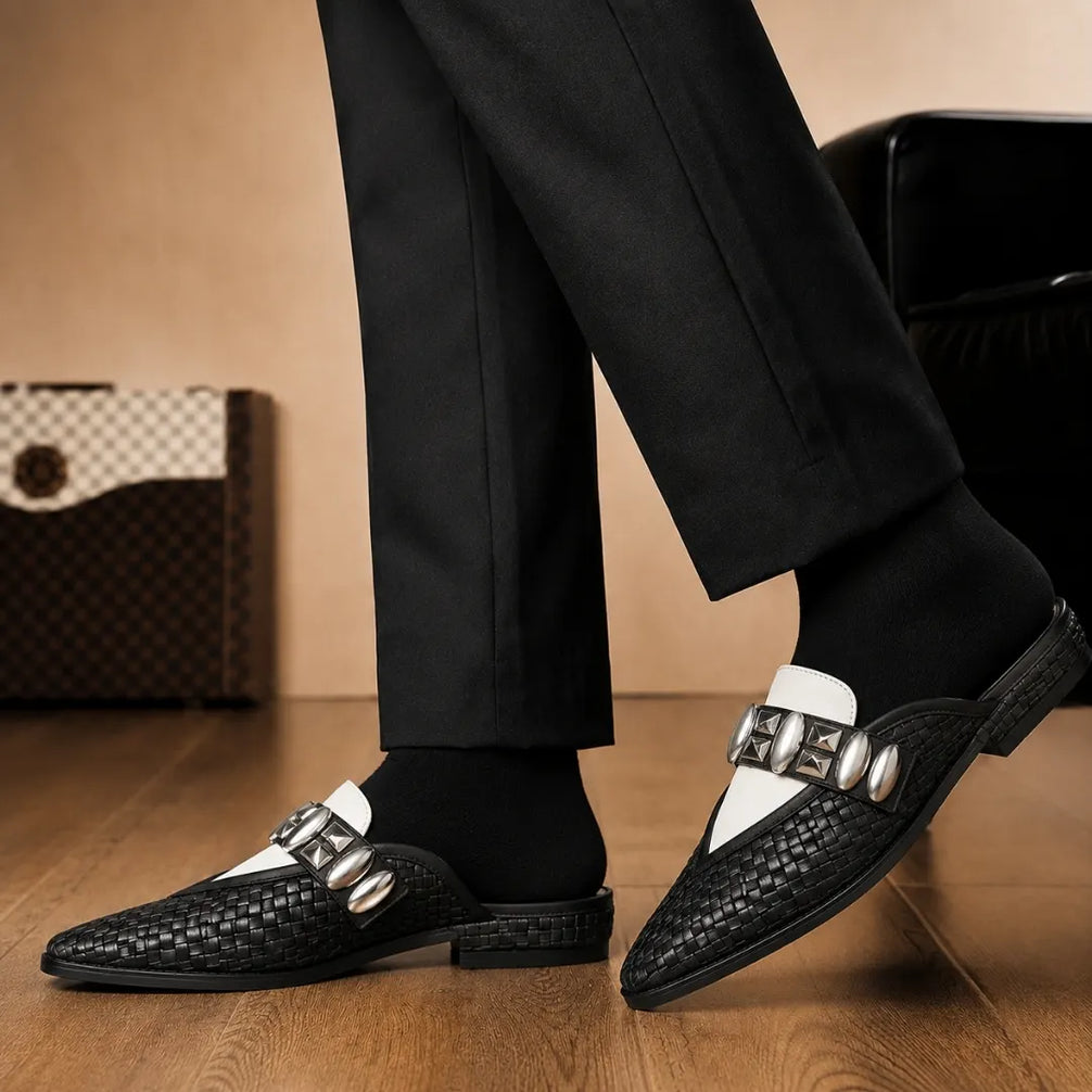 Melodiapelle Monatella Mule in black and white woven leather worn with formal trousers, on-feet shot