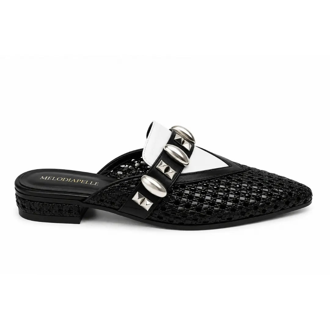 Side profile of the Monatella Mule in black and white woven leather on white background