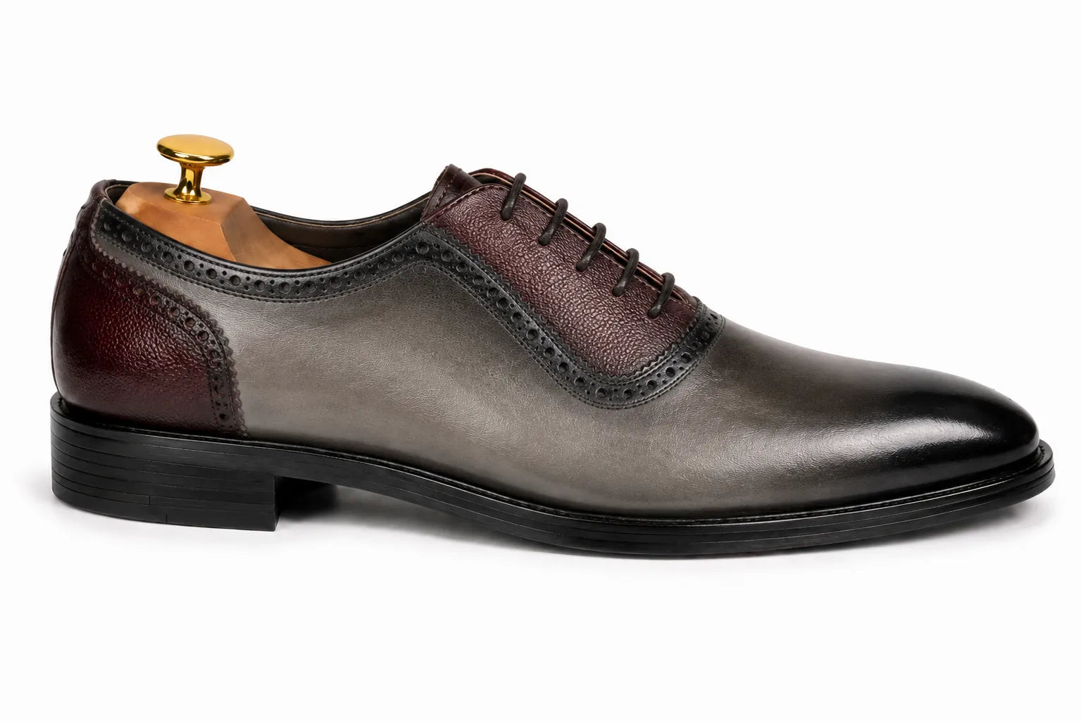 Side profile of the Mondrian Two-Tone Saddle Oxford in storm grey and bordeaux leather on white background