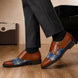 Melodiapelle Monfort Tartan Monk Strap in tan leather with blue tartan panel worn with trousers, styled on-feet shot