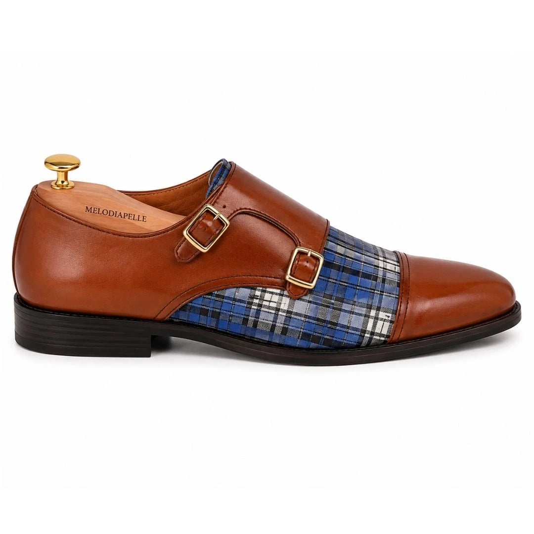 Side profile of the Monfort Tartan Monk Strap in tan leather with blue tartan detailing on white background