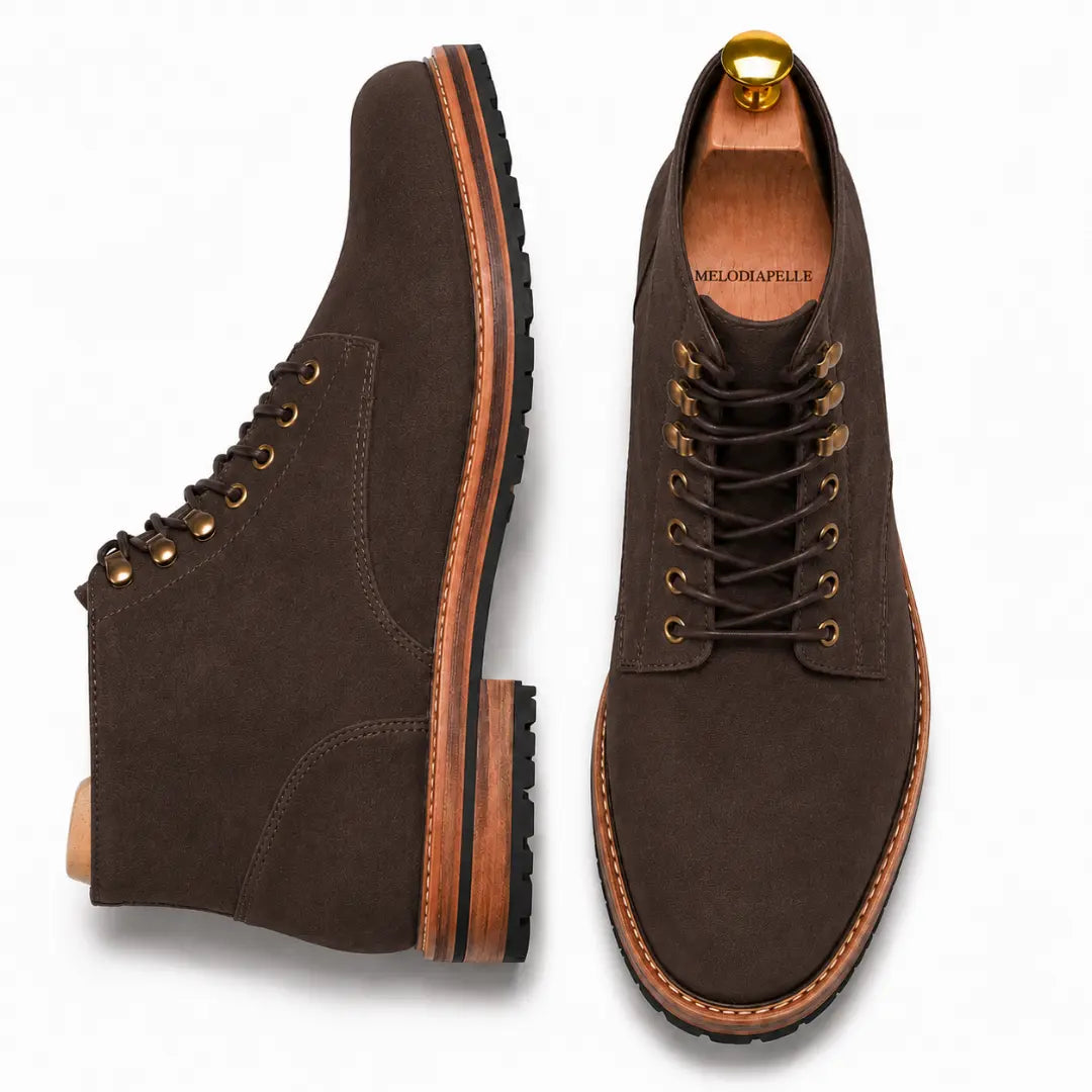 Brown leather heritage lace-up boot, three-quarter angle showing heel and sole detailing