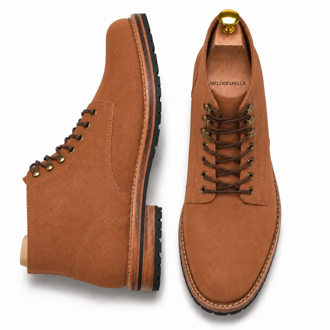 Tan leather heritage lace-up boot, three-quarter angle showing heel and sole detailing