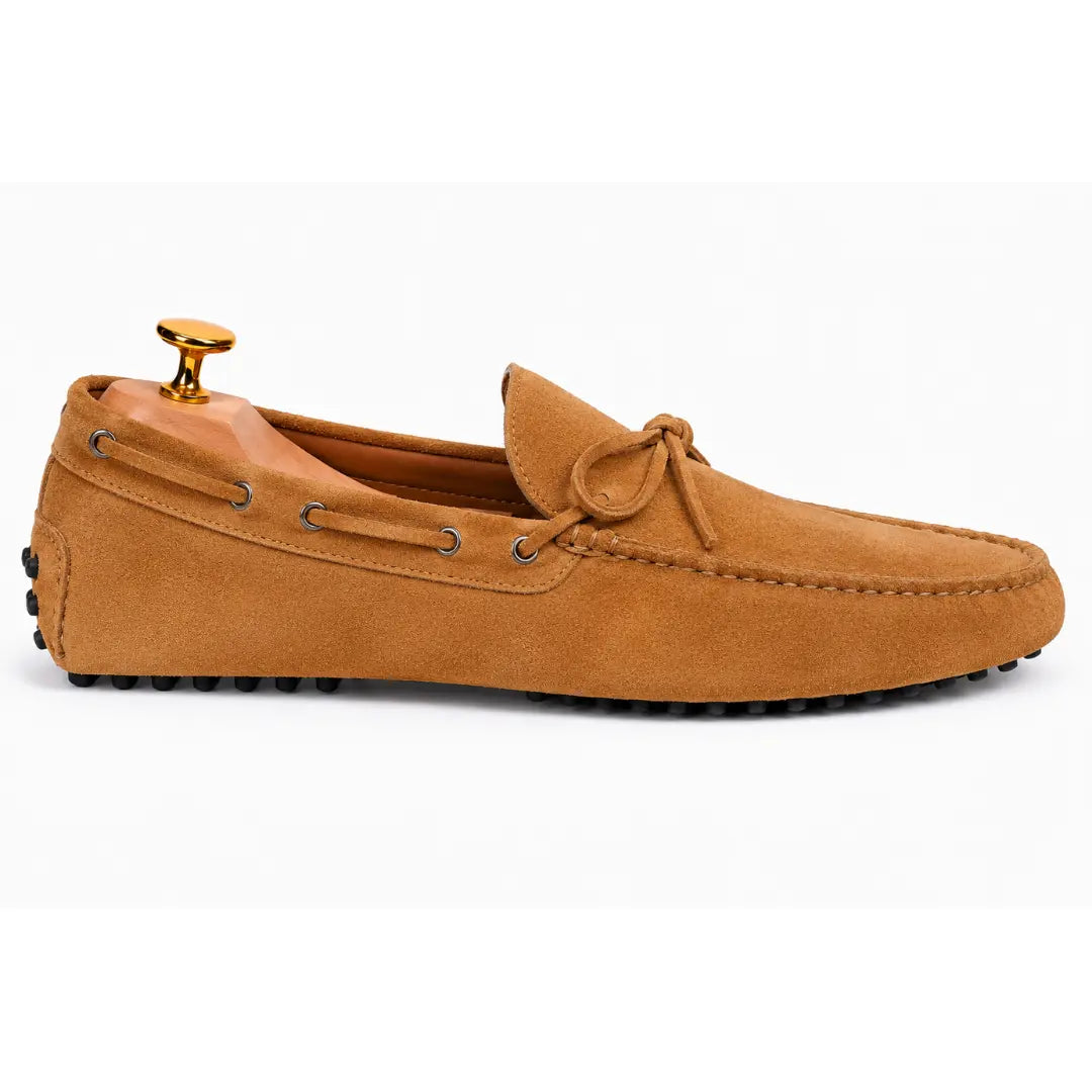 Side profile of the Montgomery Loafer in camel tan suede on white background