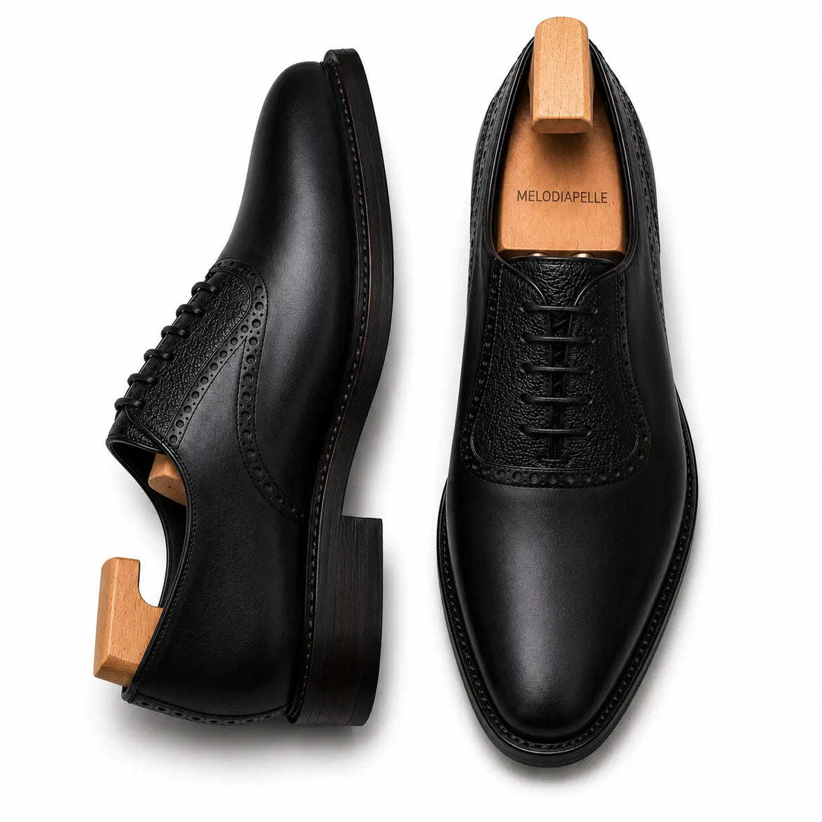 Black leather saddle Oxford, three-quarter angle showing heel and two-tone detailing