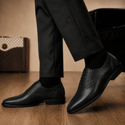 Melodiapelle Montserrat Two-Tone Saddle Oxford in black leather worn with formal trousers, on-feet shot