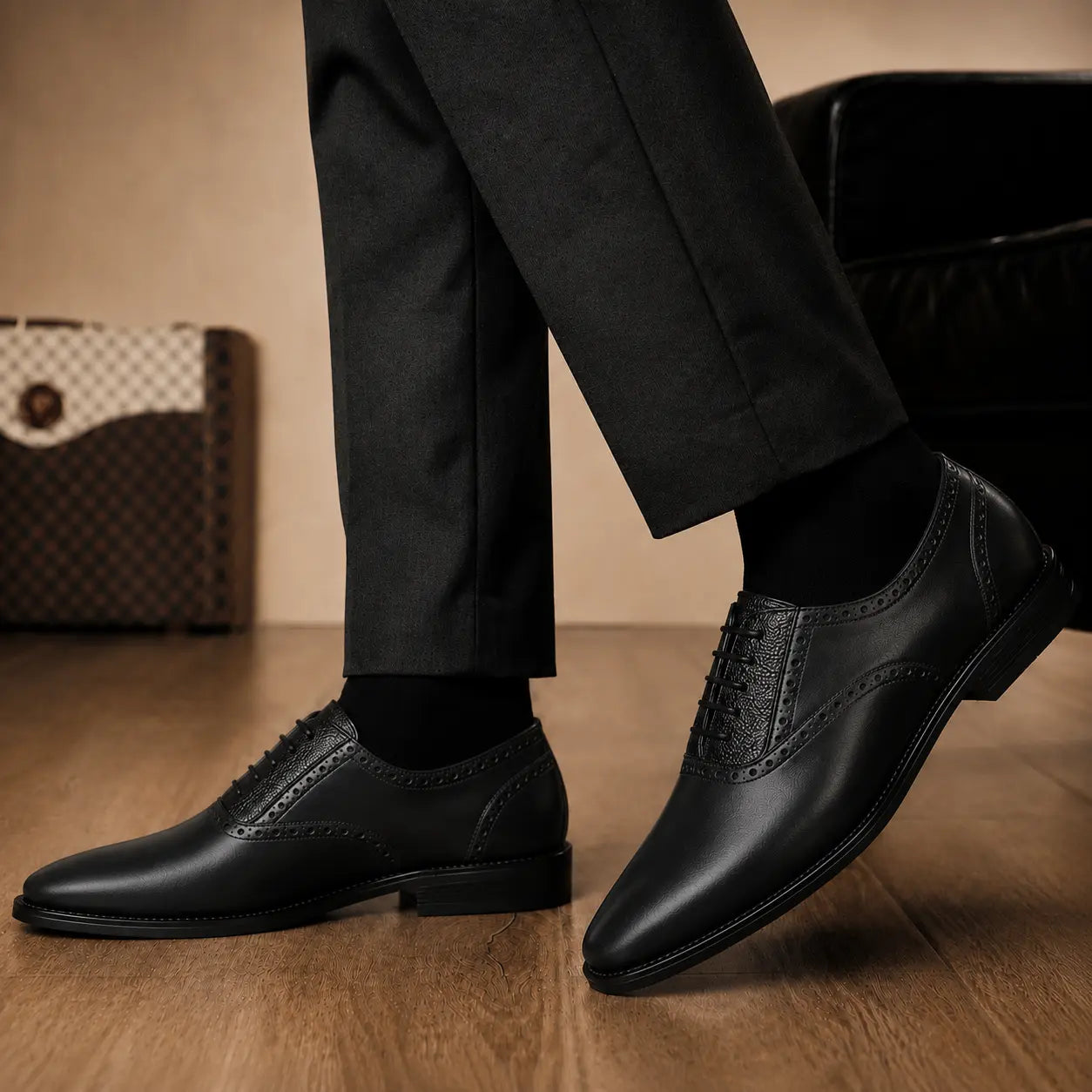 Melodiapelle Montserrat Two-Tone Saddle Oxford in black leather worn with formal trousers, on-feet shot