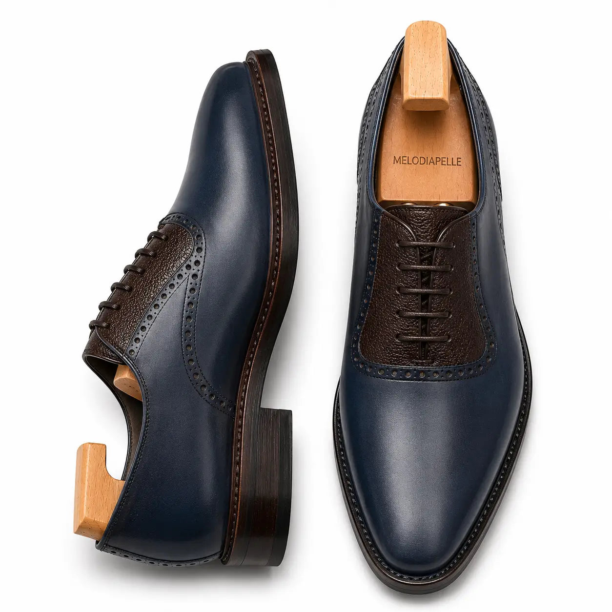Navy and dark brown leather saddle Oxford, three-quarter angle showing heel and two-tone detailing