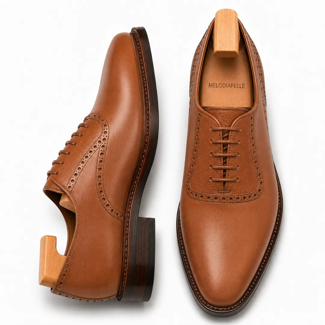Tan leather saddle Oxford, three-quarter angle showing heel and two-tone detailing