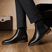 Melodiapelle Moorfield Slim Chelsea Boot in black suede worn with formal trousers, on-feet shot
