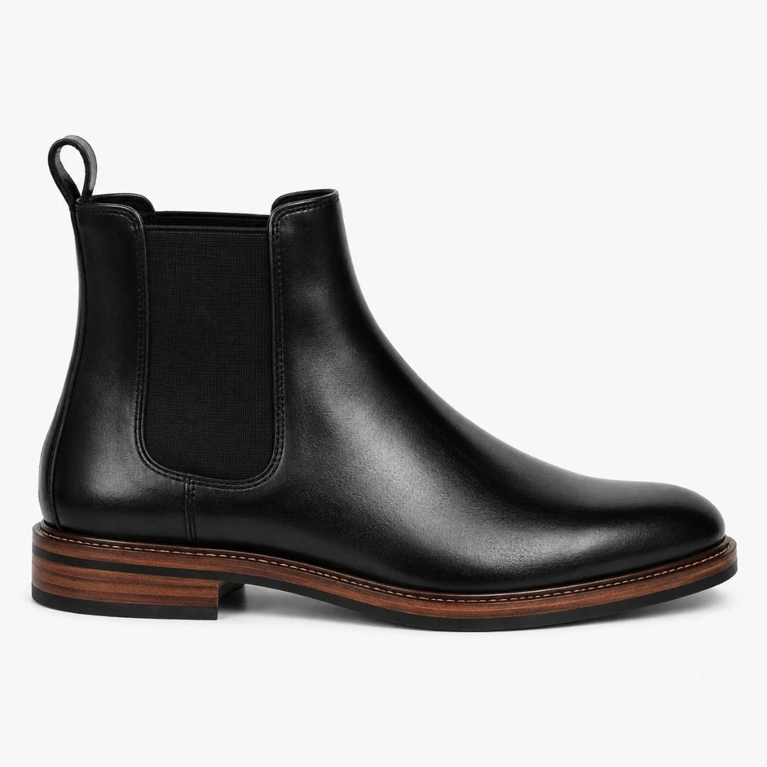 Side profile of the Moorfield Slim Chelsea Boot in black suede on white background