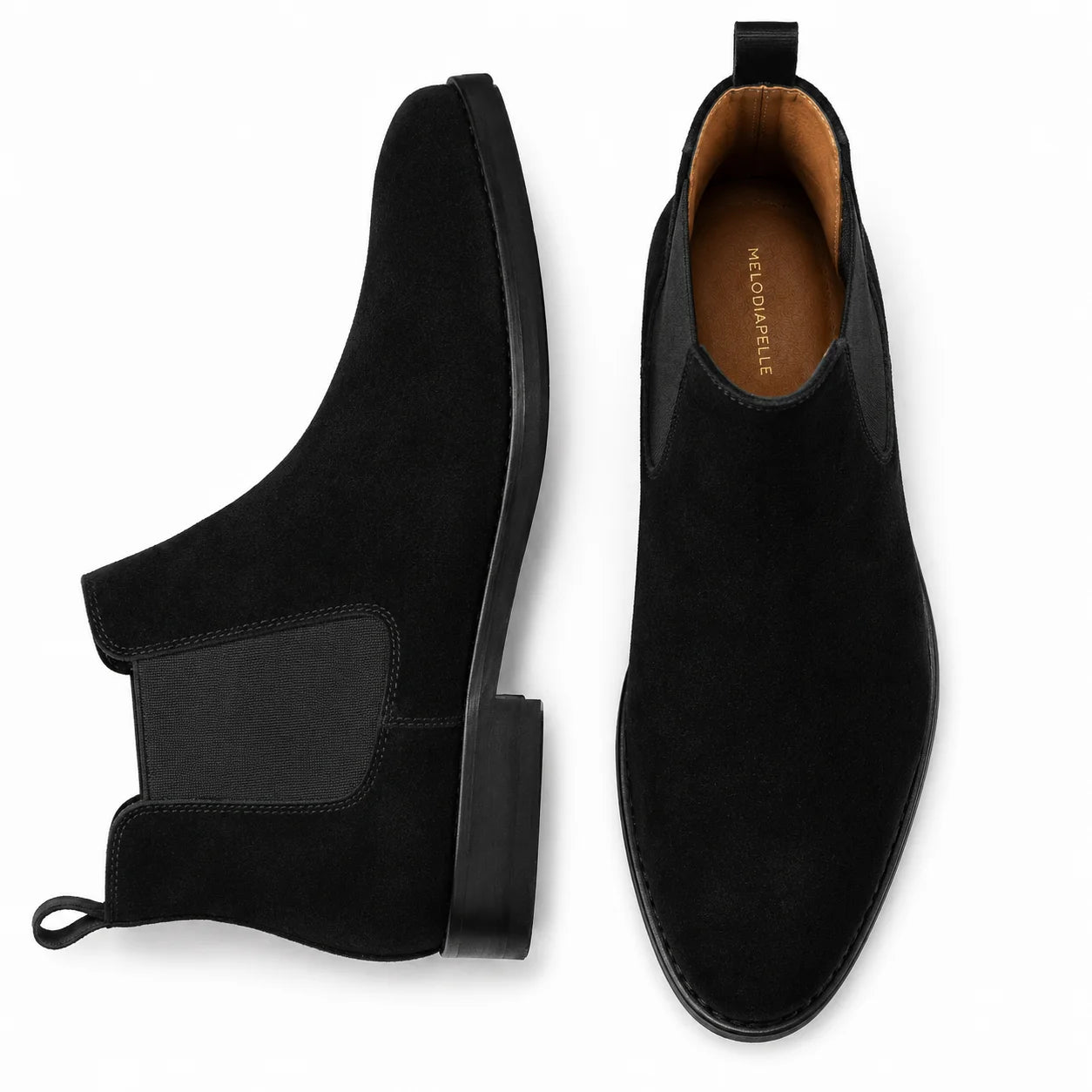 Jet black suede Chelsea boot, three-quarter angle showing heel and elastic side panel