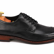 Side profile of the Morano Wingtip Brogue Derby in black leather on white background