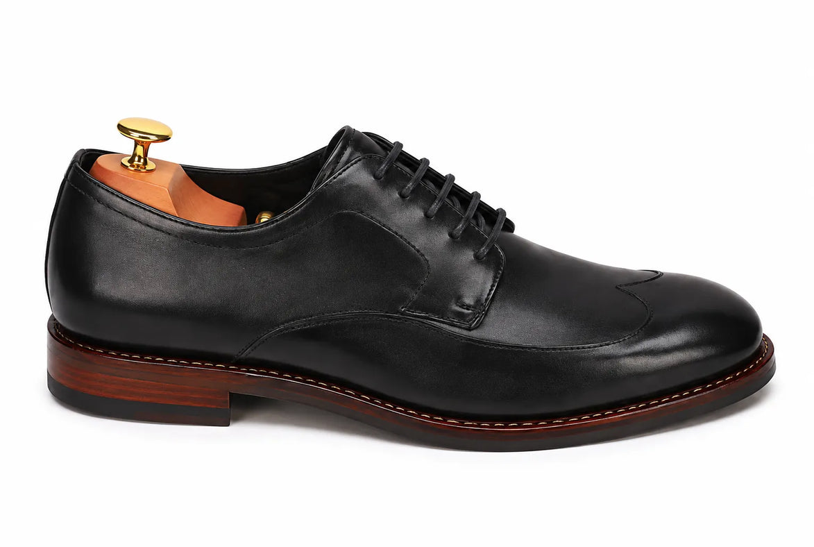 Side profile of the Morano Wingtip Brogue Derby in black leather on white background