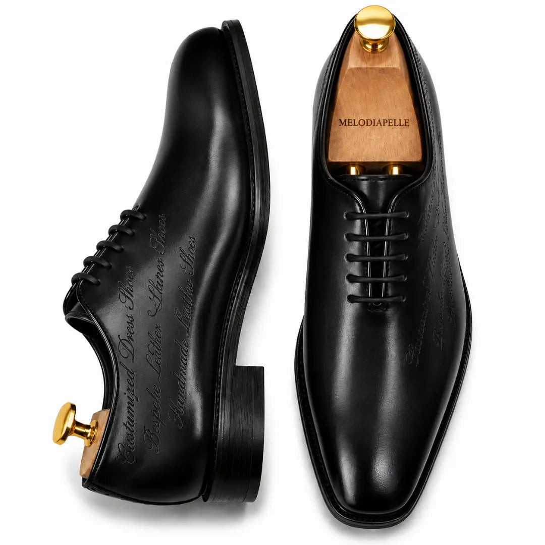 Black leather wholecut Oxford, three-quarter angle showing seamless upper and heel
