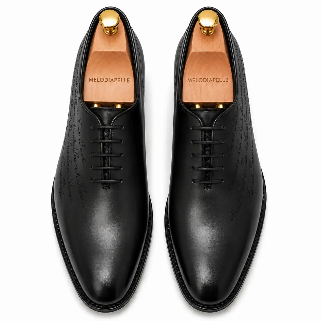 Melodiapelle Mordecai Script Wholecut Oxford in black leather, pair top-down view, handcrafted in Agra