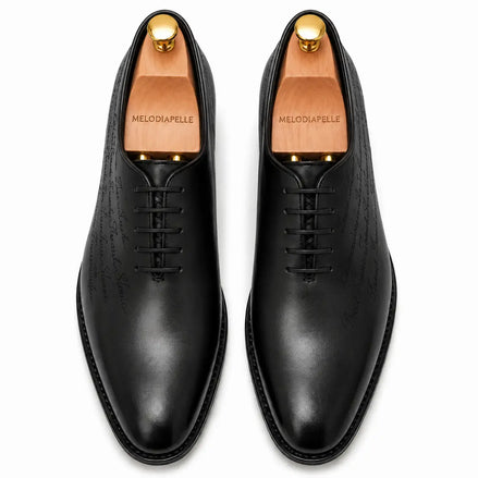 Melodiapelle Mordecai Script Wholecut Oxford in black leather, pair top-down view, handcrafted in Agra