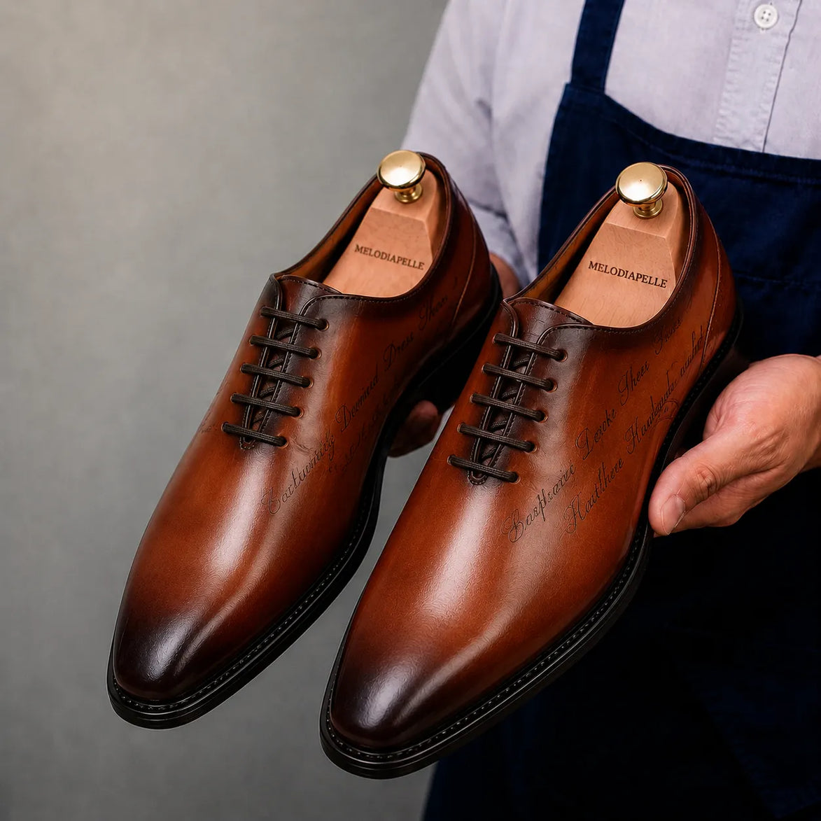 Man wearing Melodiapelle Mordecai Script Wholecut Oxford in cognac tan with formal trousers, on-feet shot