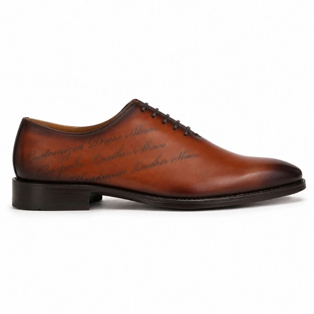 Side profile of the Mordecai Script Wholecut Oxford in cognac tan leather on white background