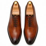 Melodiapelle Mordecai Script Wholecut Oxford in cognac tan leather, pair top-down view, handcrafted in Agra