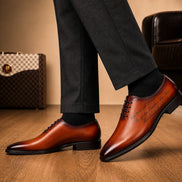 Melodiapelle Mordecai Script Wholecut Oxford in cognac tan leather, styled close-up