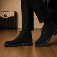 Melodiapelle Moreno Combat Boot in black suede worn with trousers, on-feet shot