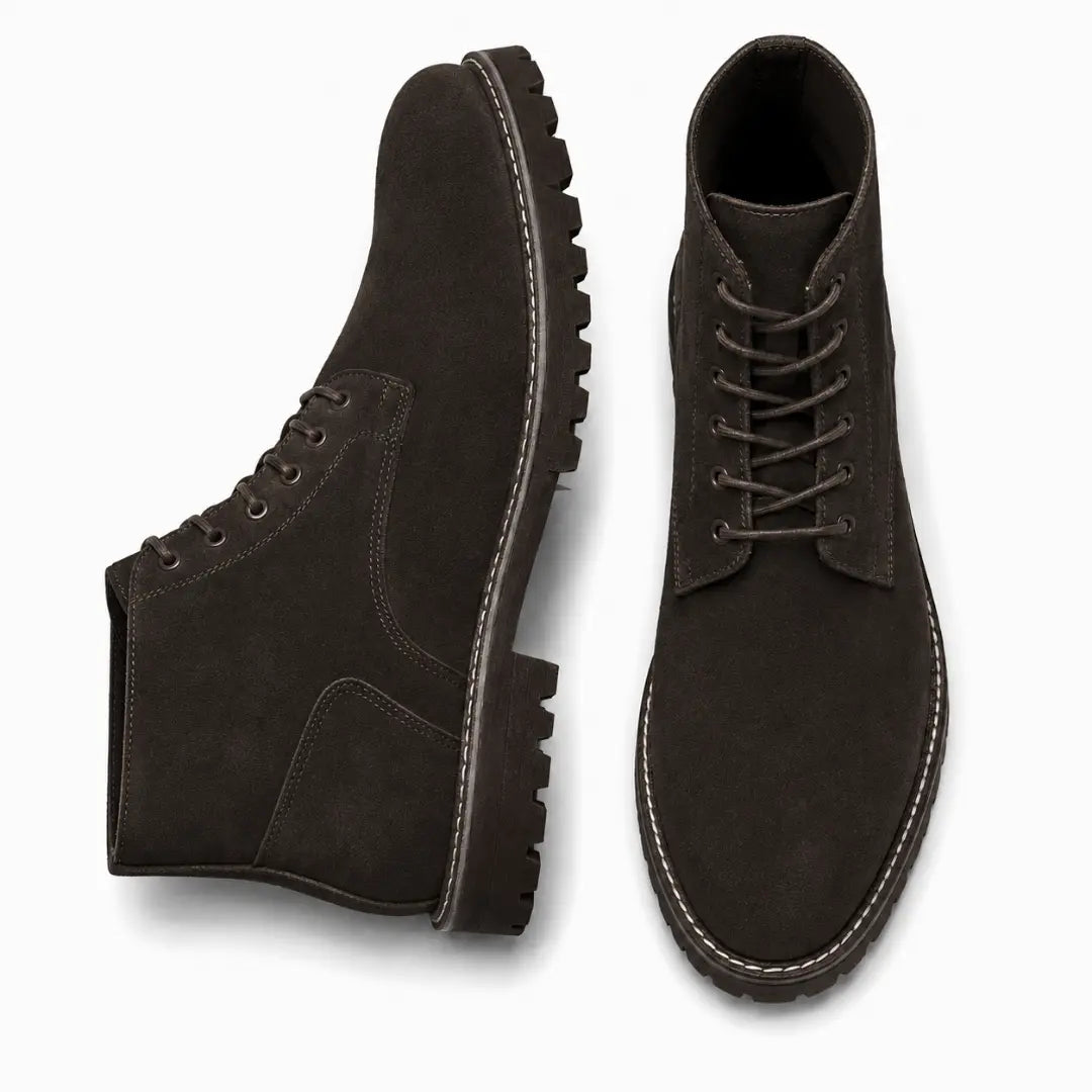 Dark brown suede combat boot, three-quarter angle showing heel and sole detailing
