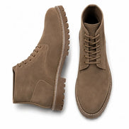 Sand beige suede combat boot, three-quarter angle showing heel and sole detailing