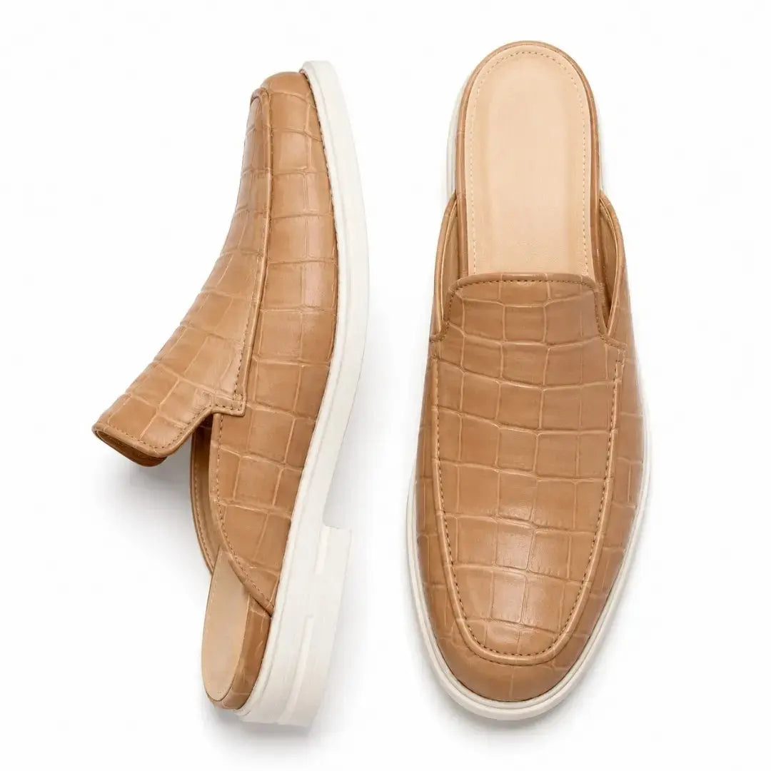 Sand beige croc-embossed leather mule, three-quarter angle showing heel and sole detailing