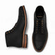 Black leather combat boot, three-quarter angle showing cap-toe and heel detailing