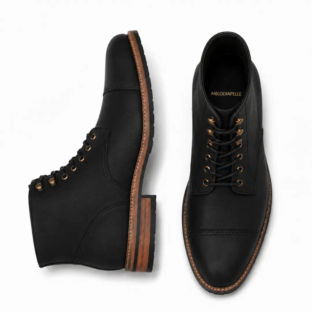 Black leather combat boot, three-quarter angle showing cap-toe and heel detailing
