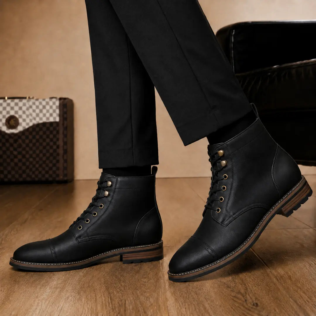 Melodiapelle Morocco Cap Toe Combat Boot in black leather worn with trousers, on-feet shot