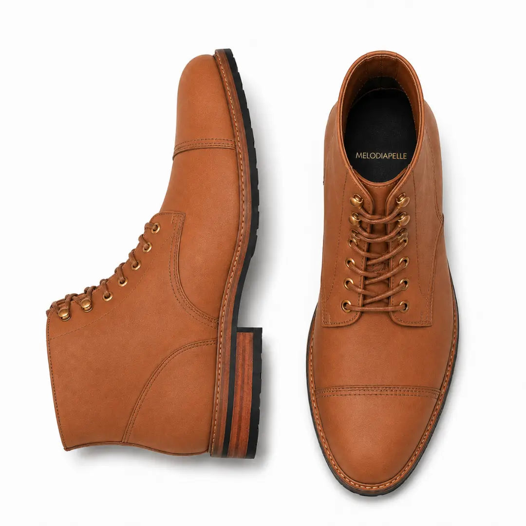 Tan leather combat boot, three-quarter angle showing cap-toe and heel detailing
