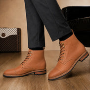 Melodiapelle Morocco Cap Toe Combat Boot in tan leather worn with trousers, on-feet shot