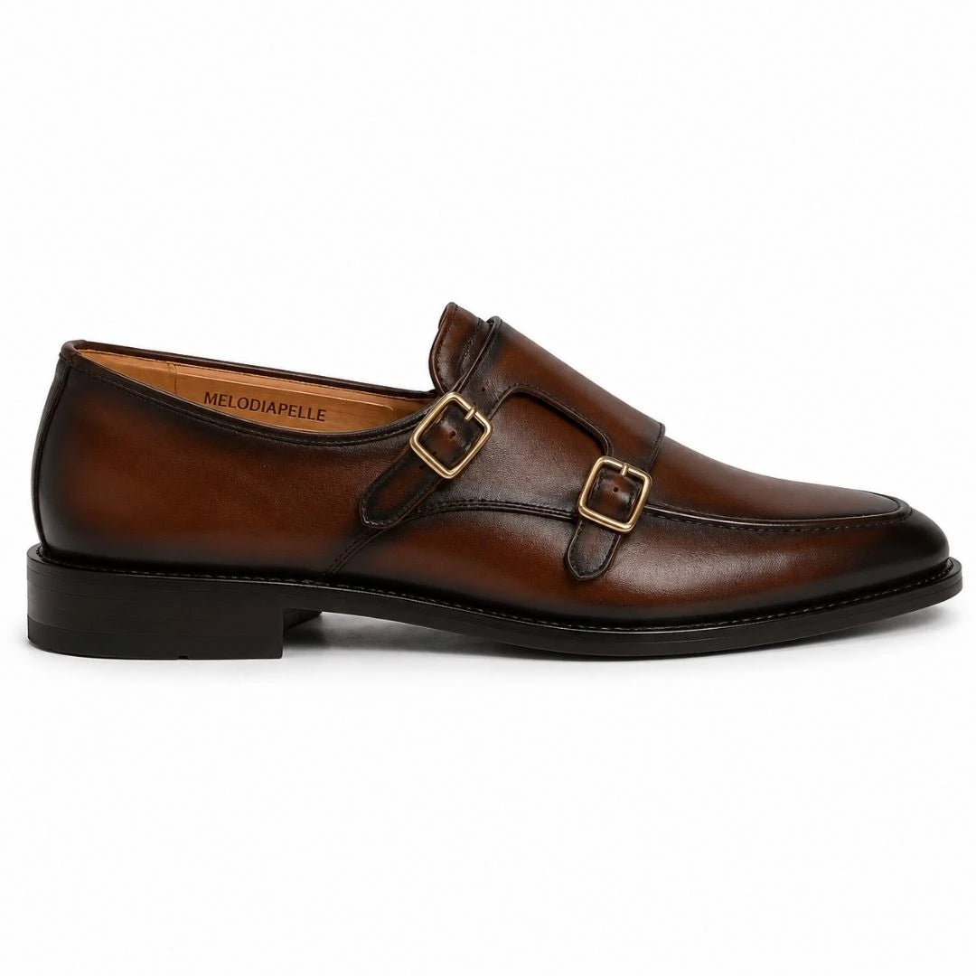 Side profile of the Mortimer Apron Monk Strap in cognac brown leather on white background