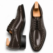 Brown leather studded apron Derby, three-quarter angle showing heel and stud detailing