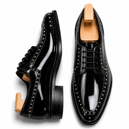 Nero black leather studded apron Derby, three-quarter angle showing heel and stud detailing