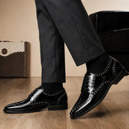 Melodiapelle Mortlach Studded Apron Derby in nero black leather worn with formal trousers, on-feet shot