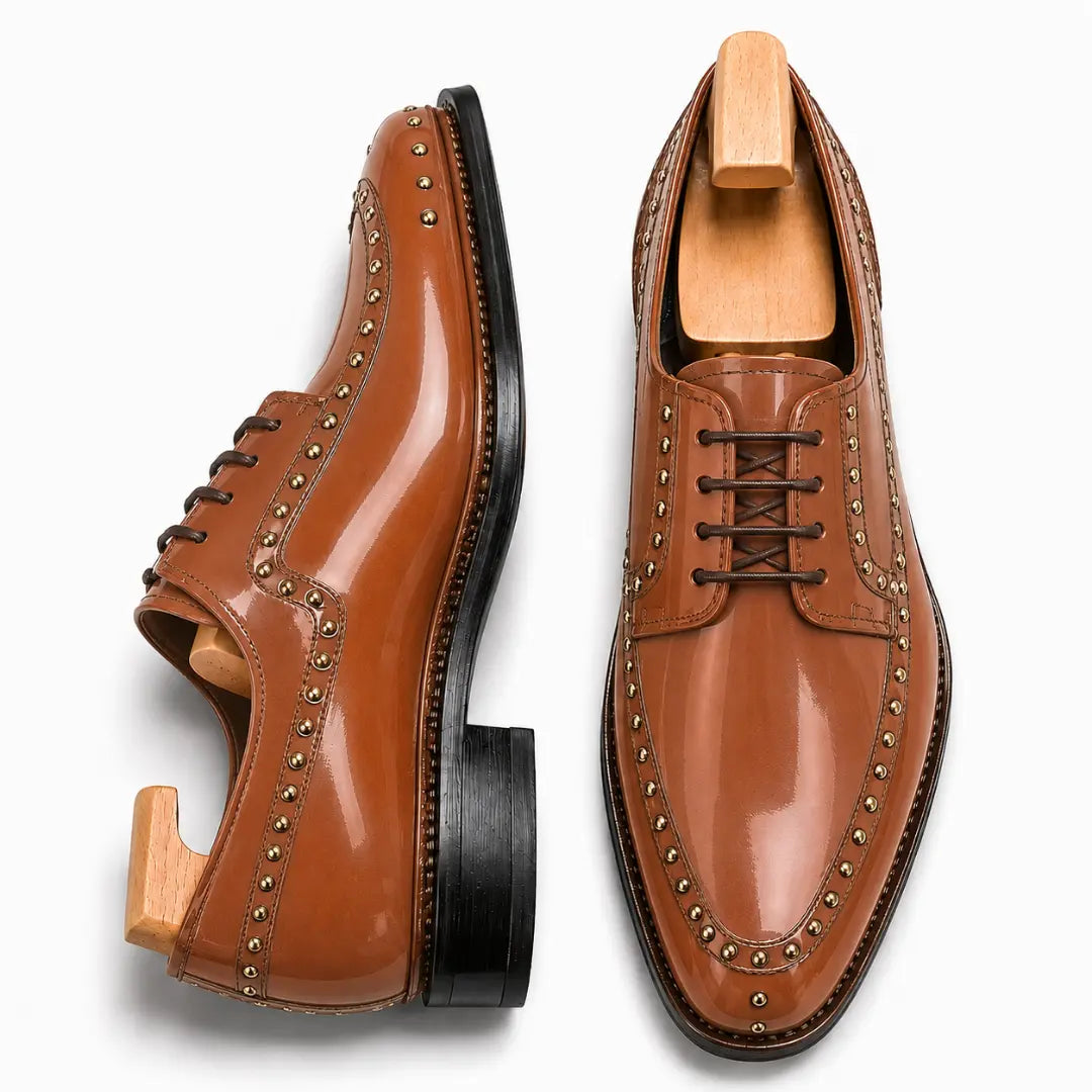 Tan leather studded apron Derby, three-quarter angle showing heel and stud detailing