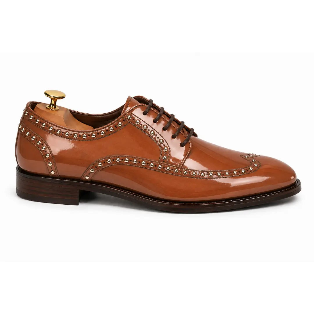 Side profile of the Mortlach Studded Apron Derby in tan leather on white background